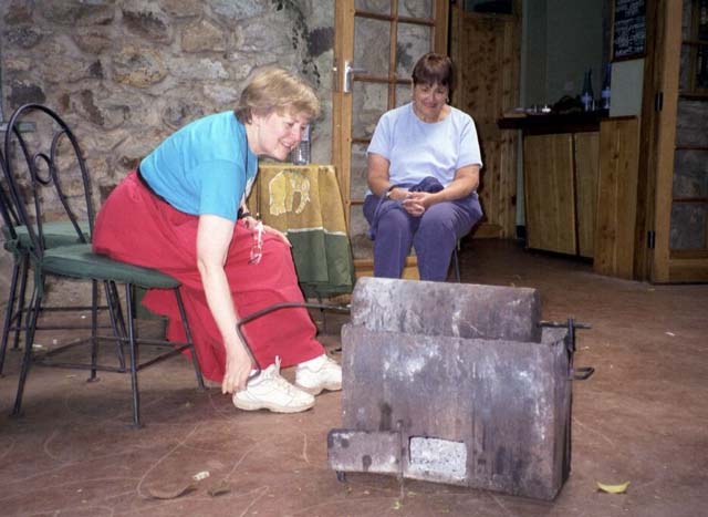 Shirley grinding coffee beans at Gibbs Farm