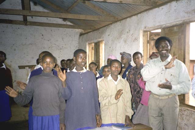 The school children singing for us