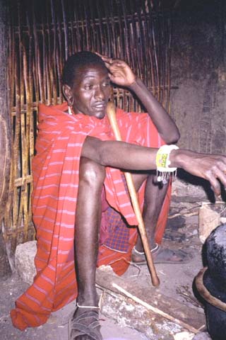 A Masai man inside his home