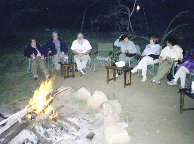 Sitting around a campfire at the OAT camp