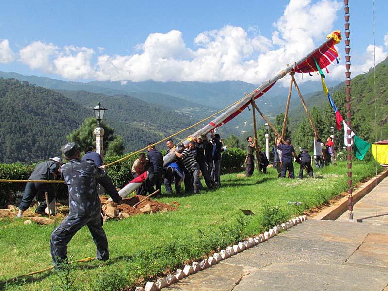 Prayer flag pole lifting