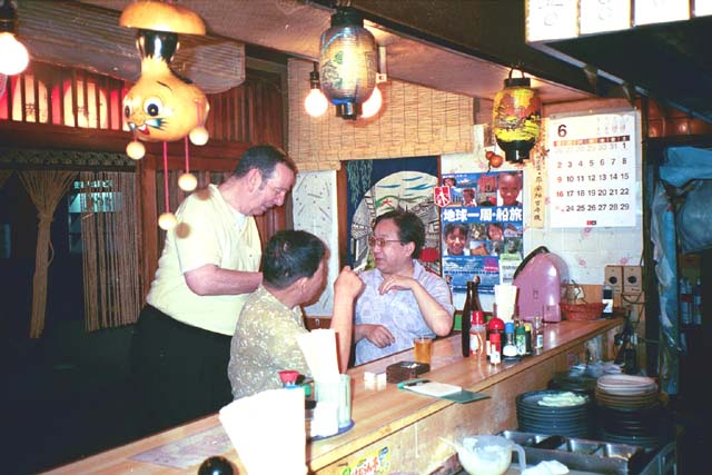 Sam talking to owner of a Kyoto restaurant